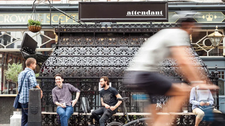 The ironwork entrance and street-level seating at Attendant Fitzrovia