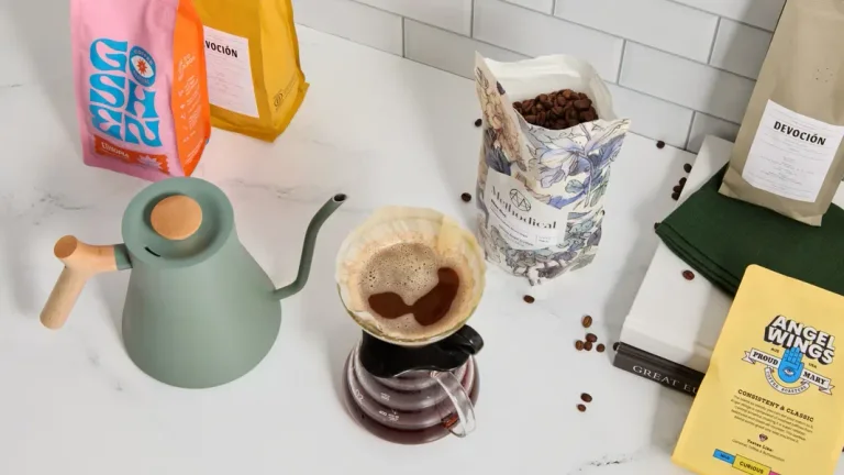 Bean Box subscription example with assorted roaster coffee bags, beans and pour-over equipment