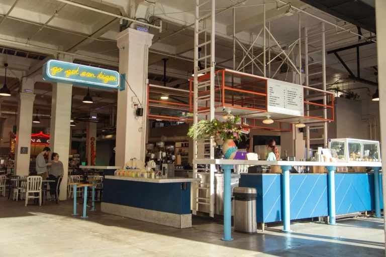 G&B Coffee counter surrounded by the high roof and stalls of Grand Central Market