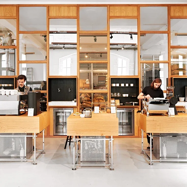 Wood-framed interior and coffee counter at Bonanza’s Adalbertstraße roastery café