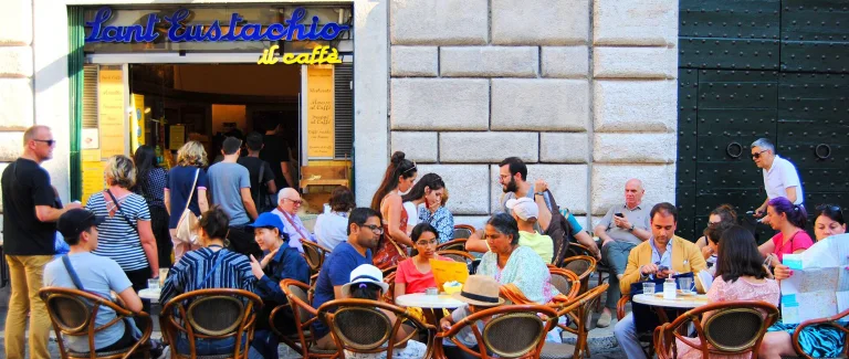 Customers at outdoor tables in front of Sant’Eustachio Il Caffè in Rome