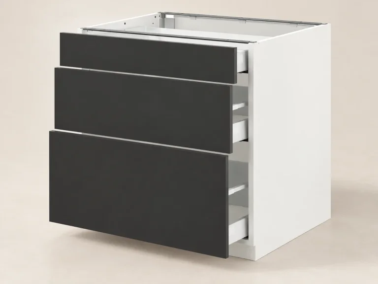 Uninstalled white IKEA SEKTION cabinet with three matte anthracite NICKEBO drawer fronts and no worktop or legs
