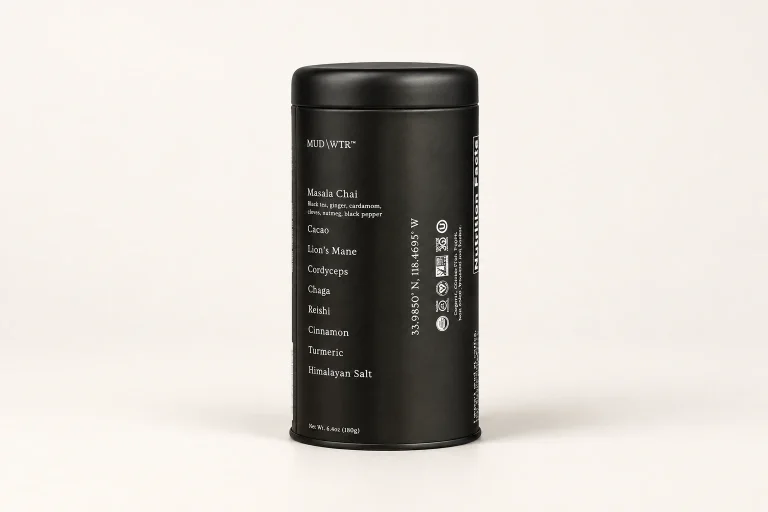 MUD/WTR Original 180 g tin in its earlier black packaging on a neutral studio background