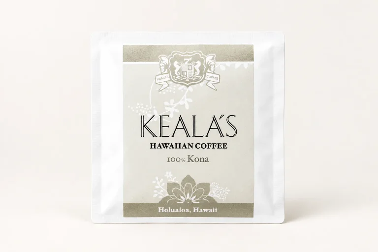 Keala’s Hawaiian Coffee 100% Kona white packet in a neutral studio setting