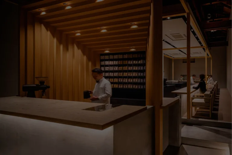 Wooden counter and carefully arranged interior at KOFFEE MAMEYA Kakeru