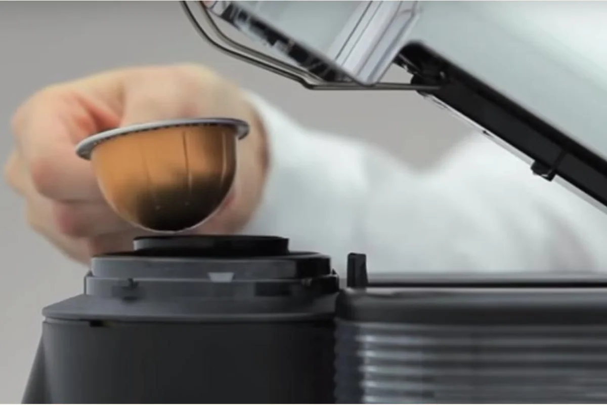 Nespresso VertuoLine capsule being placed into the machine