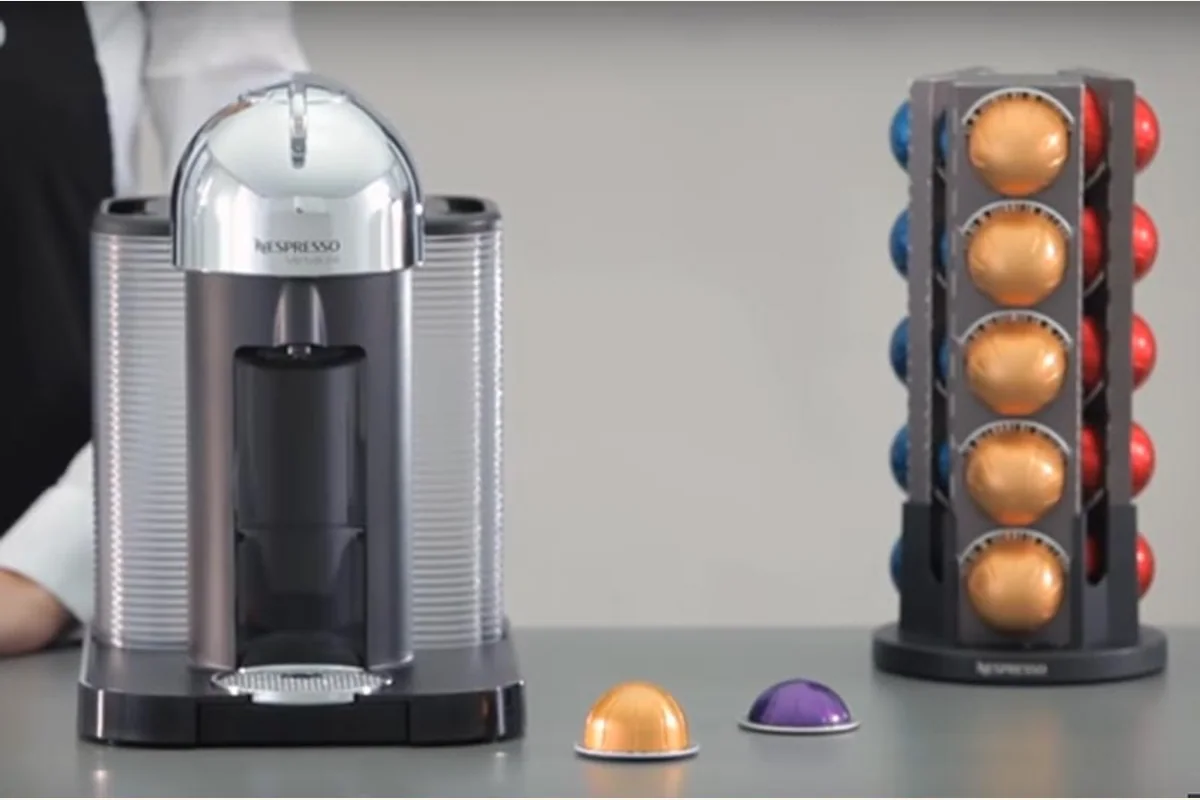 Nespresso VertuoLine machine with capsule tower and milk drink