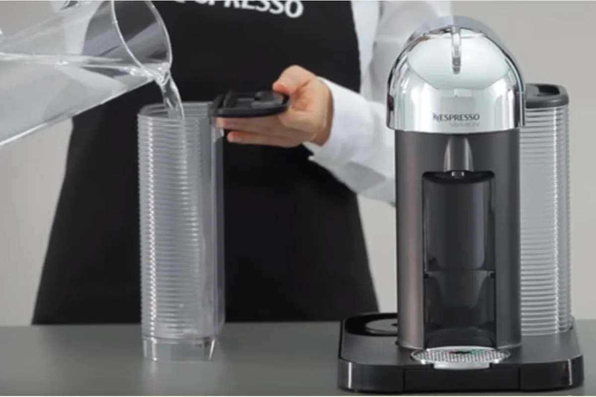 Opening the Nespresso VertuoLine capsule head and filling the water tank